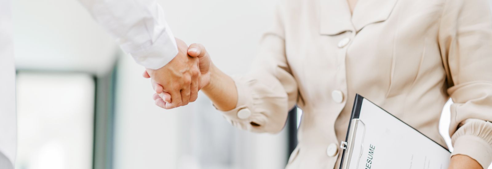 Handshake between professionals during a hiring conversation.